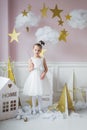 Little happy fairy or angel with magic wand on Holiday theme. Portrait of pretty caucasian little angel wearing white Royalty Free Stock Photo