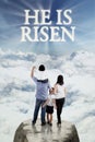 Little happy family looking at text he is risen Royalty Free Stock Photo