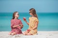 Little happy funny girls have a lot of fun at tropical beach playing together Royalty Free Stock Photo