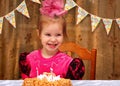 Little happy girl celebrating her birthday at the festive dinner Royalty Free Stock Photo