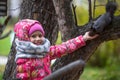 Little happy girl with hand feeding a squirrel in the Park. Royalty Free Stock Photo