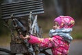 Little happy girl with hand feeding a squirrel in the Park. Royalty Free Stock Photo