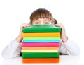 Little happy girl with pile books. isolated on white background