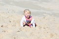 Little happy girl playing on the beach Royalty Free Stock Photo