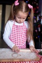 Little happy girl with rolling pin baking Royalty Free Stock Photo