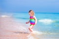 Little happy girl running on a beach Royalty Free Stock Photo