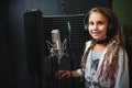 Little girl singing in recording studio