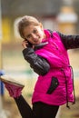 Little happy girl talking on mobile. Royalty Free Stock Photo