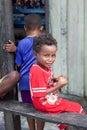 Little happy indigenous boy with biscuits in his hands