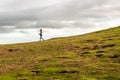 Little happy kid running on the top of thefield to the sunset side against the sky. Lifestyle. Summertime. Summer