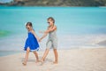 Little happy kids have a lot of fun at tropical beach playing together Royalty Free Stock Photo