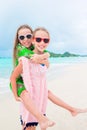 Little happy kids have a lot of fun at tropical beach playing together Royalty Free Stock Photo