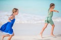 Little happy kids have a lot of fun at tropical beach playing together Royalty Free Stock Photo