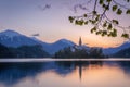 Sunrise over calm waters of Bled Lake, Slovenia Royalty Free Stock Photo