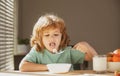 Little healthy hungry baby boy eating soup from with spoon. Child nutrition concept. Royalty Free Stock Photo
