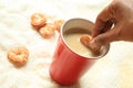 Little heart biscuit dipping into the coffee cup Royalty Free Stock Photo