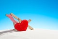 Little heart and chair for relaxing on the beach Royalty Free Stock Photo