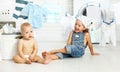 Little helpers funny kids happy sister and brother in laundry to Royalty Free Stock Photo