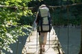 Little hiker on the suspension bridge Royalty Free Stock Photo