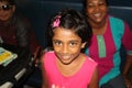 Little hindu girl with nice smile traveling on the train