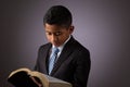 Little Hispanic Boy Reading the Holy Scriptures, The Bible, The Word of God Royalty Free Stock Photo