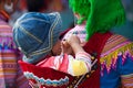 A little Hmong (Miao) child on his mother back coming down to town Royalty Free Stock Photo