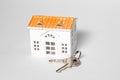 Little house with door keys isolated on white background Royalty Free Stock Photo