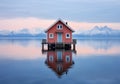 A little house in the middle of the water with mountains in the background. Color palette with the essence of nature. Winter time.