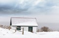 View of the coast of the Atlantic Ocean on a winter snowy day.