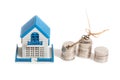 Little house toy and money isolated on a white background. Golden key, a symbol of success, business and wealth. getting the long