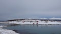 Little houses on Holdoya Island from Hinnoya in winter in Norway