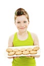 Little housewife showing cookies on tray