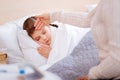 Little ill child sleeping peacefully in her bed Royalty Free Stock Photo