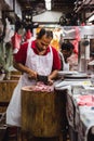 Butcher chopping meat at Tekka Centre