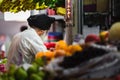 One old man at a fruit stall