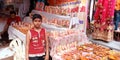 Little indian ah shopkeeper selling art object during diwali festival in India Oct 2019