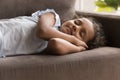Little Indian girl sleeping on sofa at home Royalty Free Stock Photo