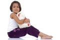 Little Indian girl with teddy bear Royalty Free Stock Photo