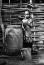 Little indian girl with water tank