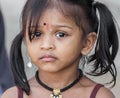 Little Indian girl with big brown eyes at the Batu caves near K