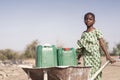 Little Indigenous Girl getting Tap Water with major difficulties
