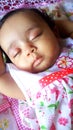 Little infant girl sleeping peaceful expression Royalty Free Stock Photo