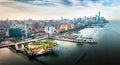 Little Island park at Pier 55 in New York new landmark of the city with Manhattan skyscrapers rising above