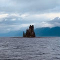 Little island with trees surrounded by the sea and mountains in Misty Fjords National Monument Royalty Free Stock Photo