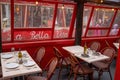 Outdoor restaurant covered seating area Little Italy NYC tables chairs