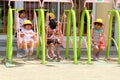 Jnue 2018, Little Japanese girls playing swinging playground outdoors, Takayama, Japan Royalty Free Stock Photo