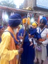 Little khalsa with mahakal khalsa NIHANG Singh at Hazoor Sahib NANDED Maharashtra India Royalty Free Stock Photo