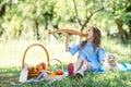 Little kid with big bread on picnic in the park