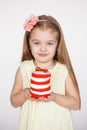 Little kid blonde girl holding a red velvet cake Royalty Free Stock Photo