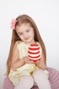 Little kid blonde girl holding a red velvet cake Royalty Free Stock Photo